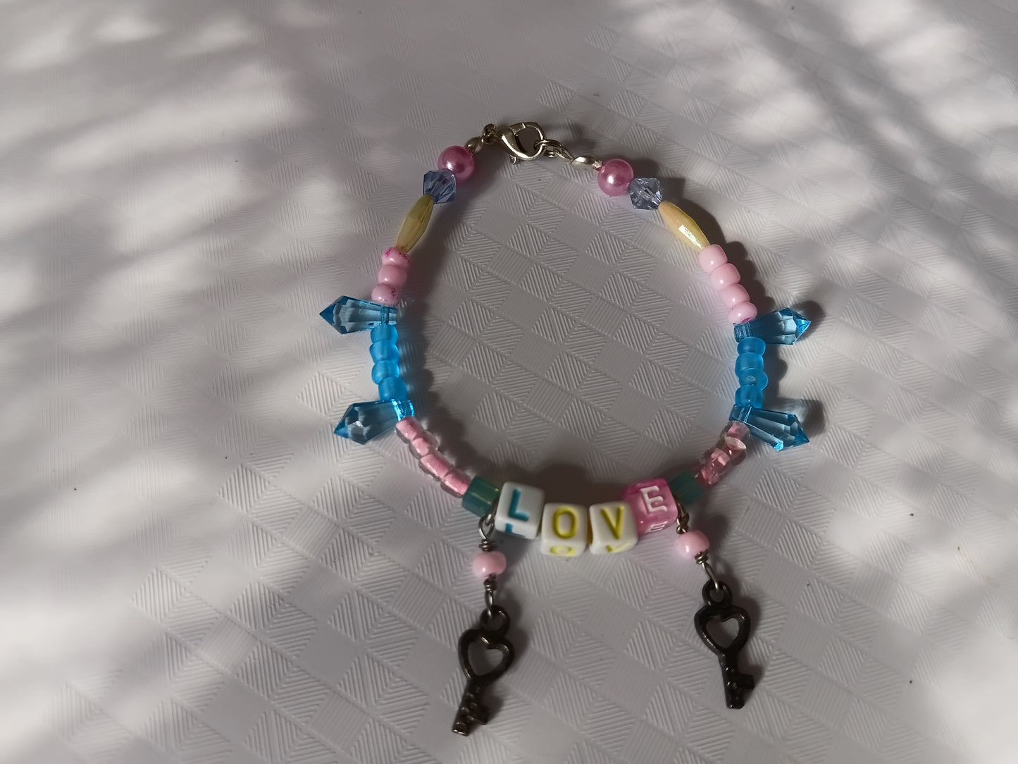 Pink and blue LOVE bracelet and earring set
