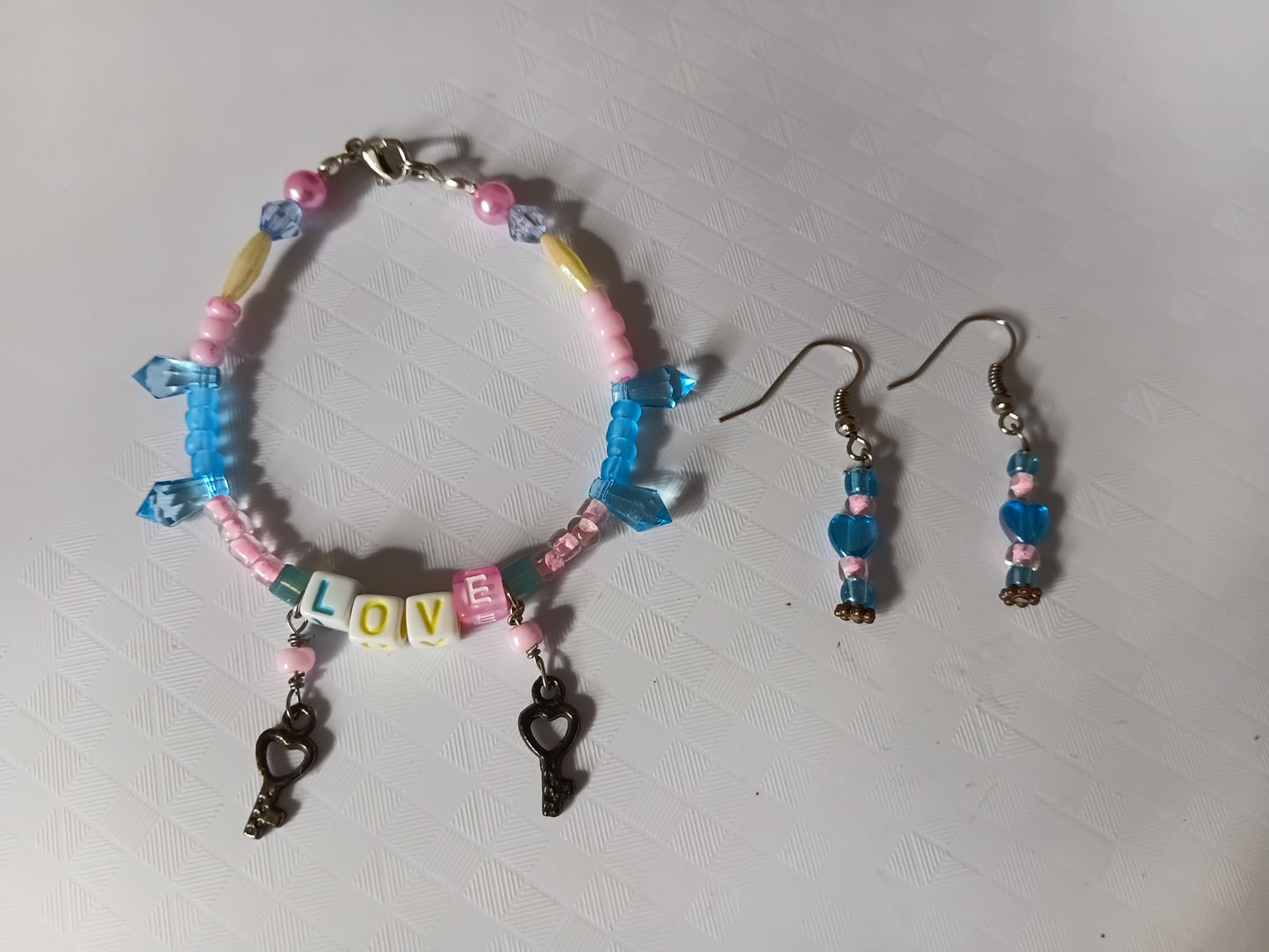 Pink and blue LOVE bracelet and earring set