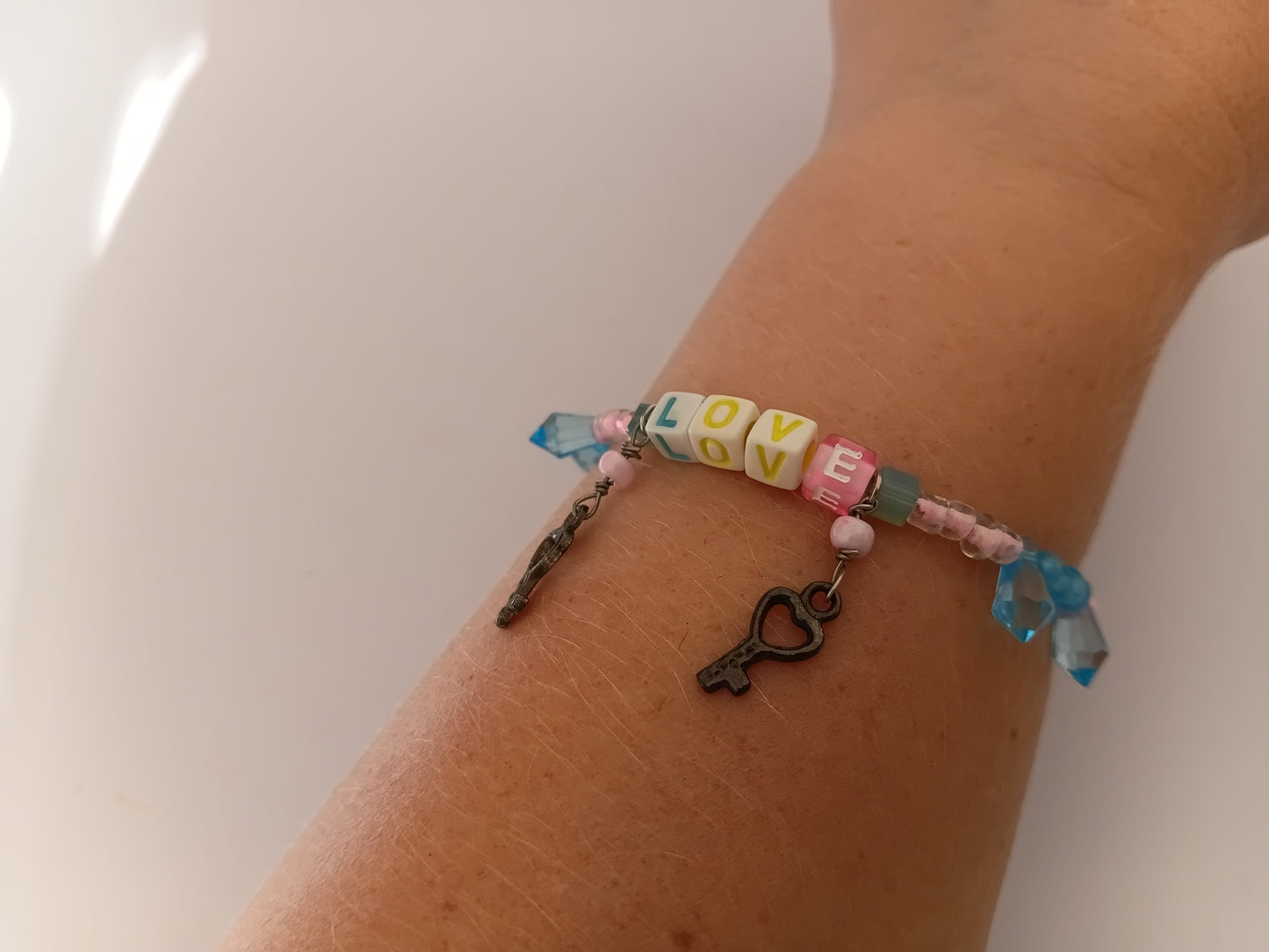 Pink and blue LOVE bracelet and earring set
