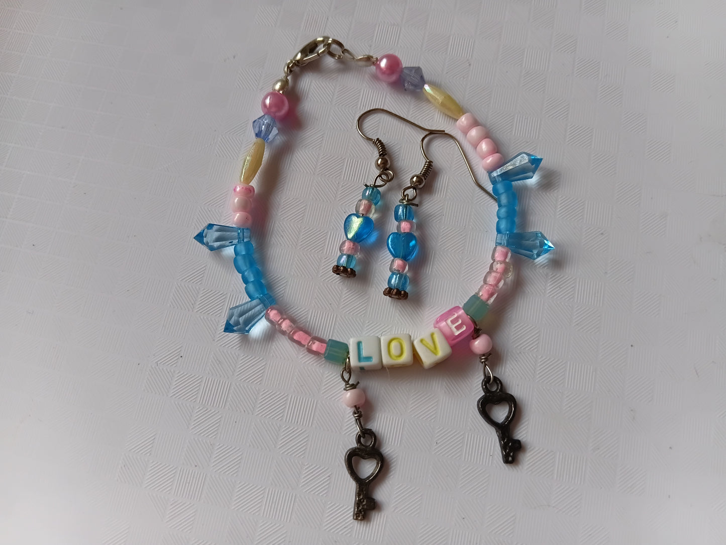 Pink and blue LOVE bracelet and earring set