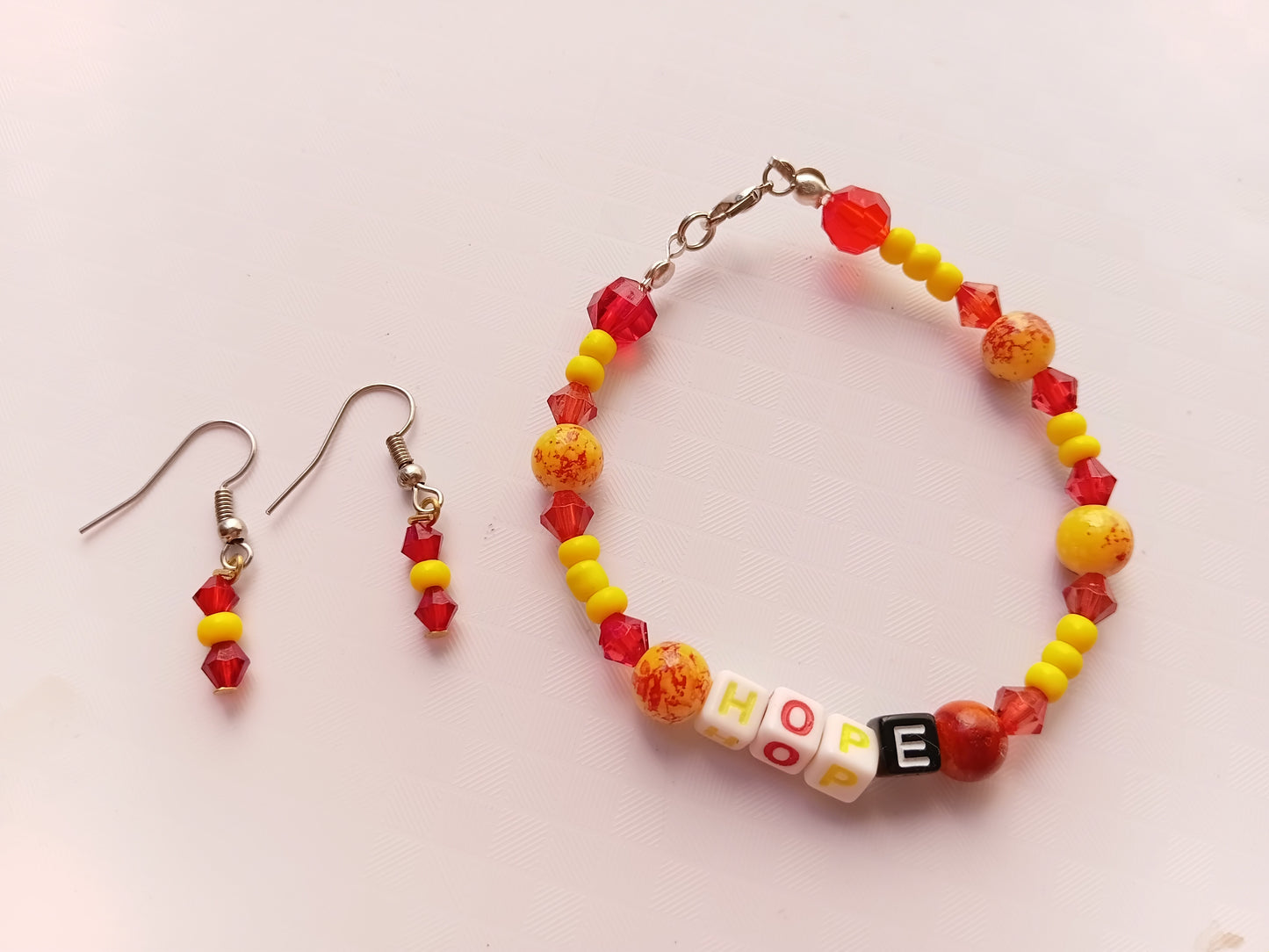 Yellow and red HOPE bracelet and earring set