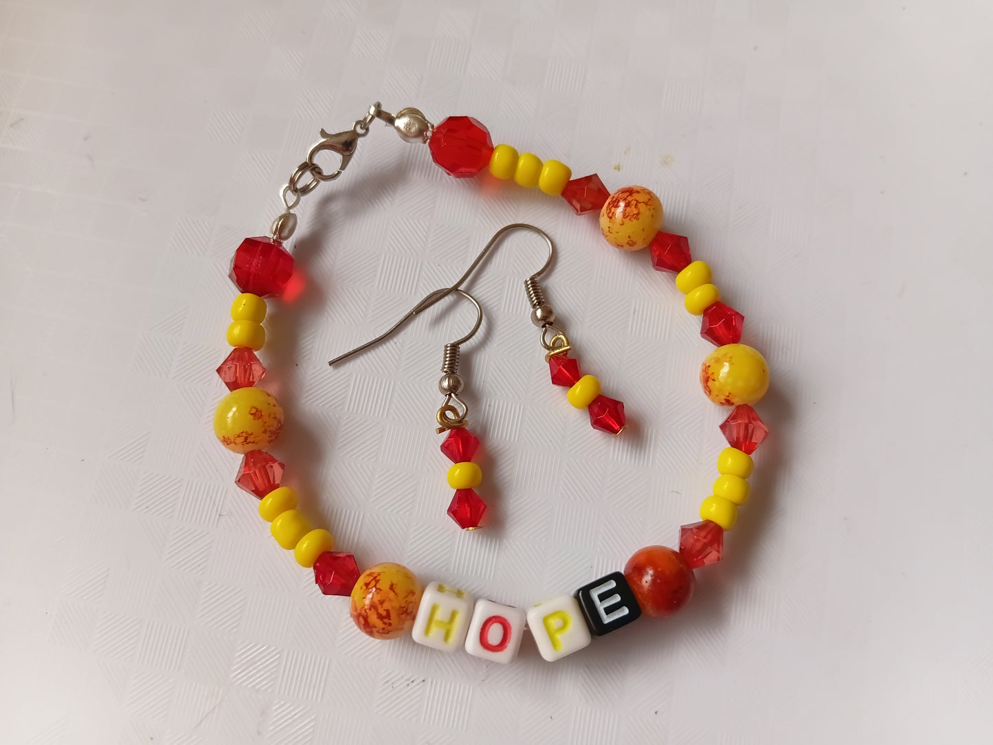 Yellow and red HOPE bracelet and earring set